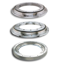 Some Ball Slewing Rings of the this series; from top to bottom: externally toothed, untoothed, internally toothed all with the same raceway diameter of 641 mm (25 in).
