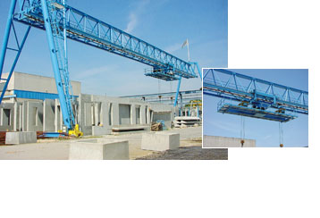 Gantry crane with rotable loading device in a concrete factory.