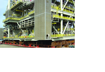 In May 2004 the world record for the heaviest load moved on wheels was claimed with this Self Propelled Modular Trailer (SPMT). The trailer was equipped with a total of 470 axle lines and 1880 wheels. The patented Slew drives, used as steering gear, took their share in reaching the world record.